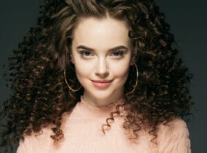 Curly hair woman beautiful face portrait